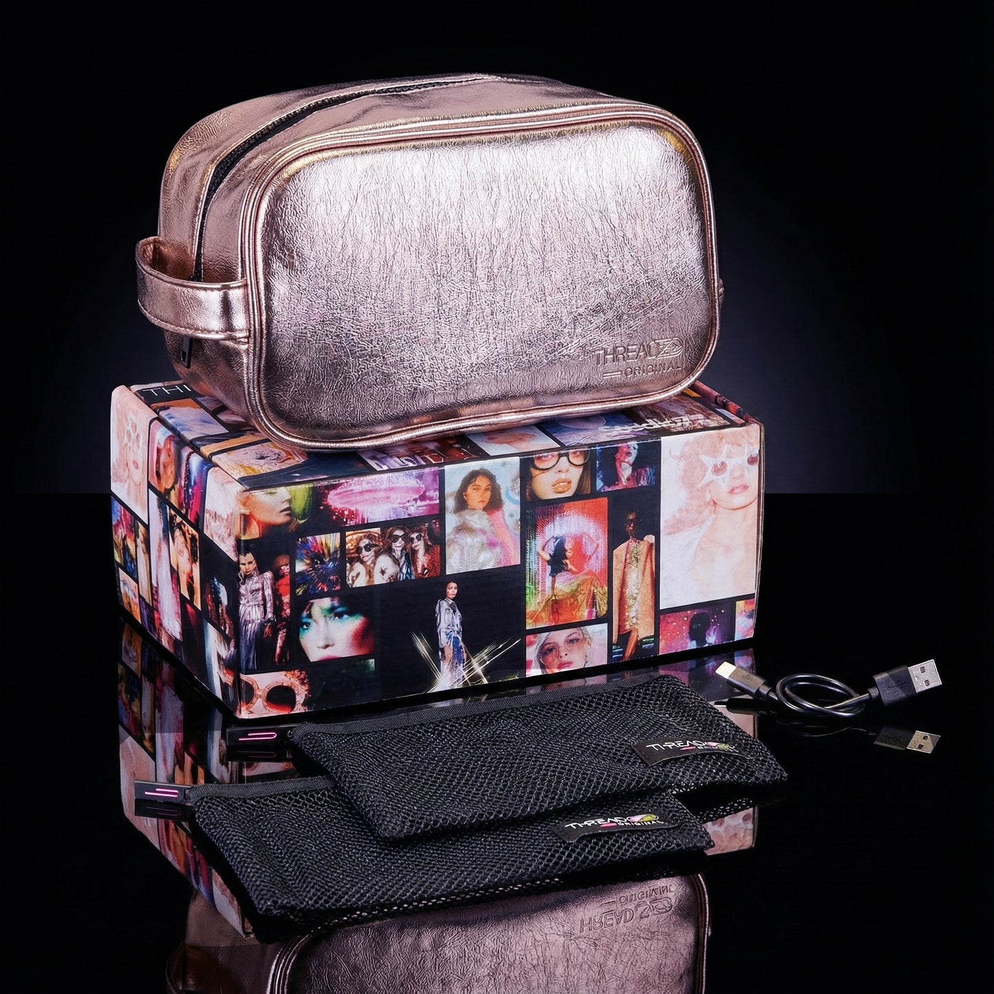 Champagne metallic LED travel makeup bag with USB charging cable and removeable mesh pouches on collectible Studio 77 gift box. Large vegan leather cosmetic organizer with rechargeable lighting and wipeable insulated lining by Thread Original. 