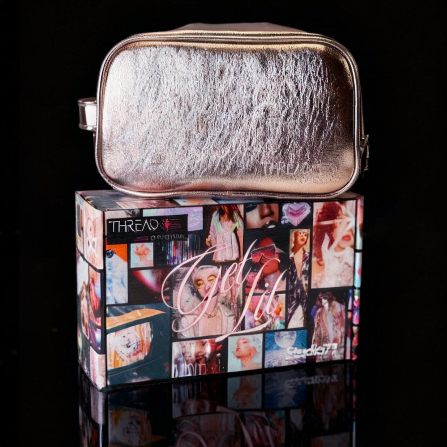 Champagne metallic LED travel makeup bag on collectible Studio 77 gift box. Large vegan leather cosmetic organizer with rechargeable lighting, wipeable insulated lining, and removeable mesh pouches by Thread Original.