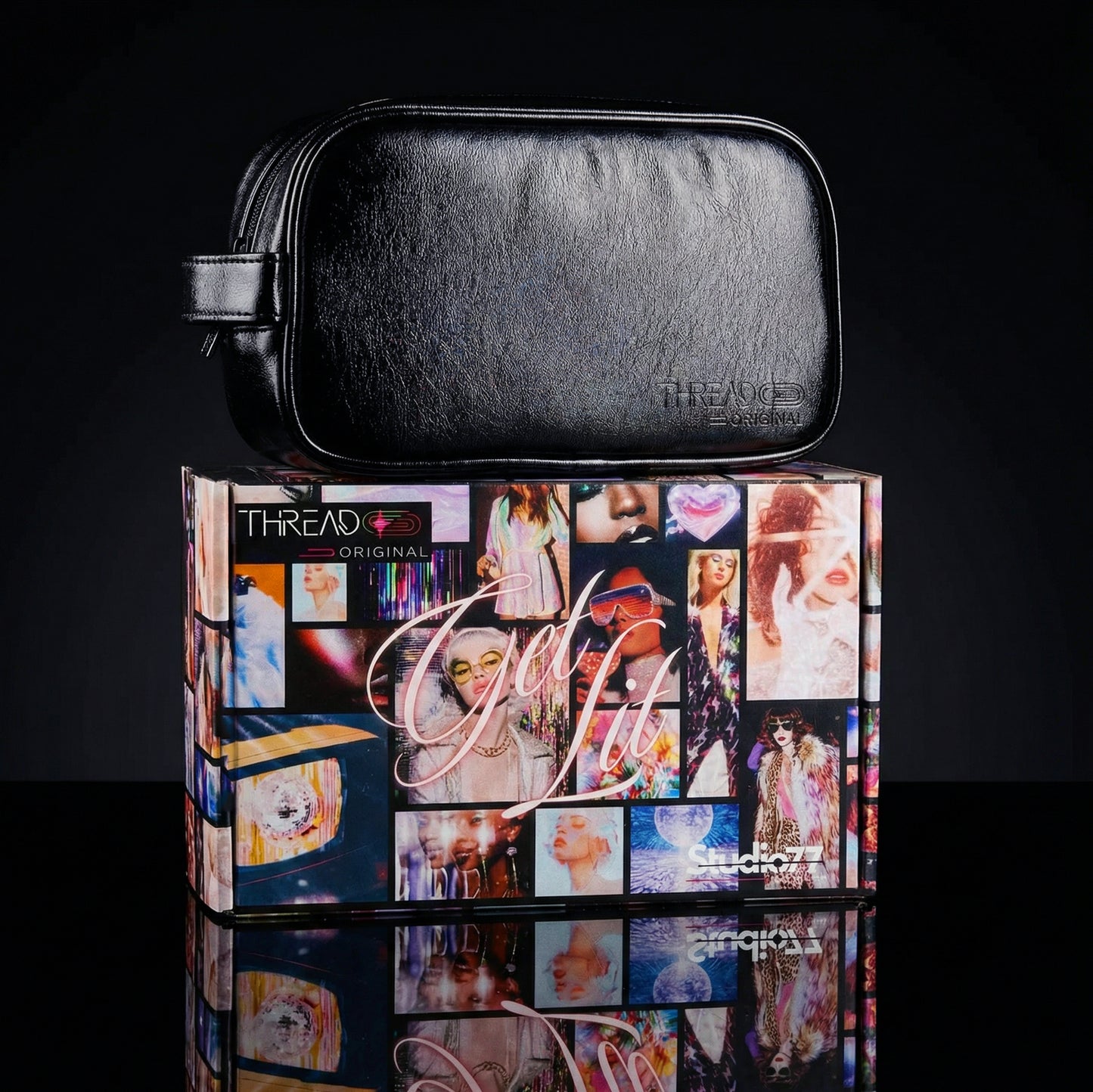 Onyx black metallic LED travel makeup bag on collectible Studio 77 gift box. Large vegan leather cosmetic organizer with rechargeable lighting, wipeable insulated lining, and removeable mesh pouches by Thread Original.