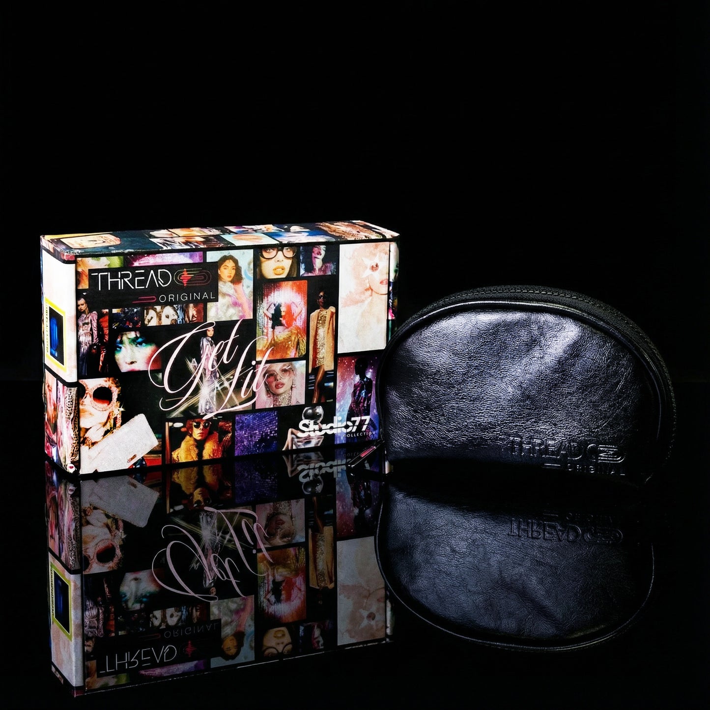 Onyx black metallic makeup bag with wipeable insulated lining beside Studio 77 collector gift box. Compact vegan leather cosmetic pouch by Thread Original.