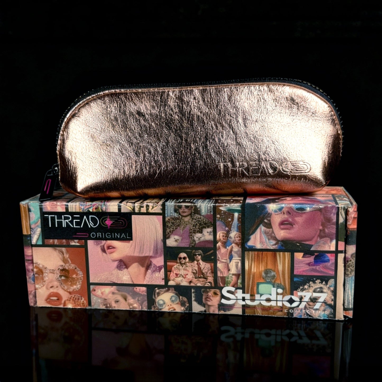 Champagne metallic compact makeup bag on collectible Studio 77 gift box. Slim vegan leather cosmetic pouch with wipeable insulated lining by Thread Original.