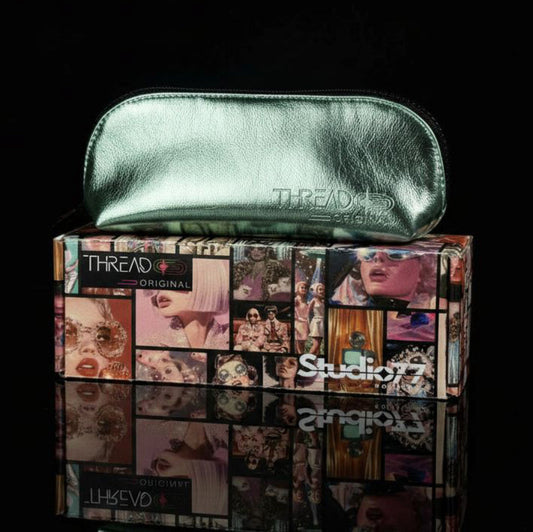 Mint green metallic compact makeup bag on collectible Studio 77 gift box. Slim vegan leather cosmetic pouch with wipeable insulated lining by Thread Original.