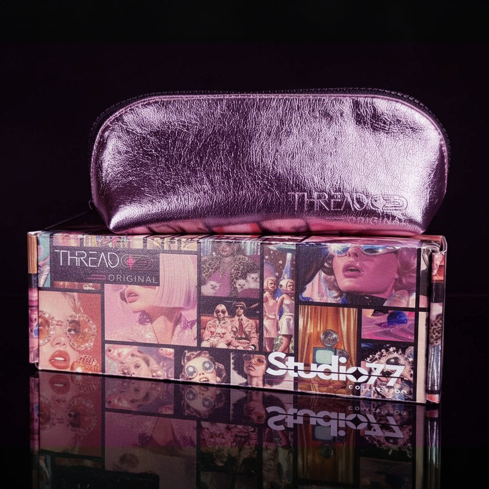 Pink metallic compact makeup bag on collectible Studio 77 gift box. Slim vegan leather cosmetic pouch with wipeable insulated lining by Thread Original.