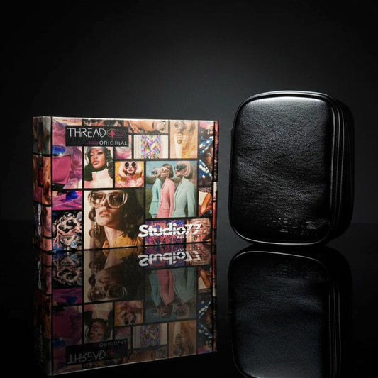 Onyx black metallic makeup organizer on collectible Studio 77 gift box. Vegan leather cosmetic bag with wipeable insulated lining and zip-around compartments by Thread Original.